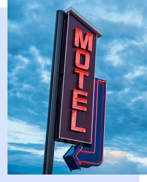 A motel sign with the word " motel " on it.