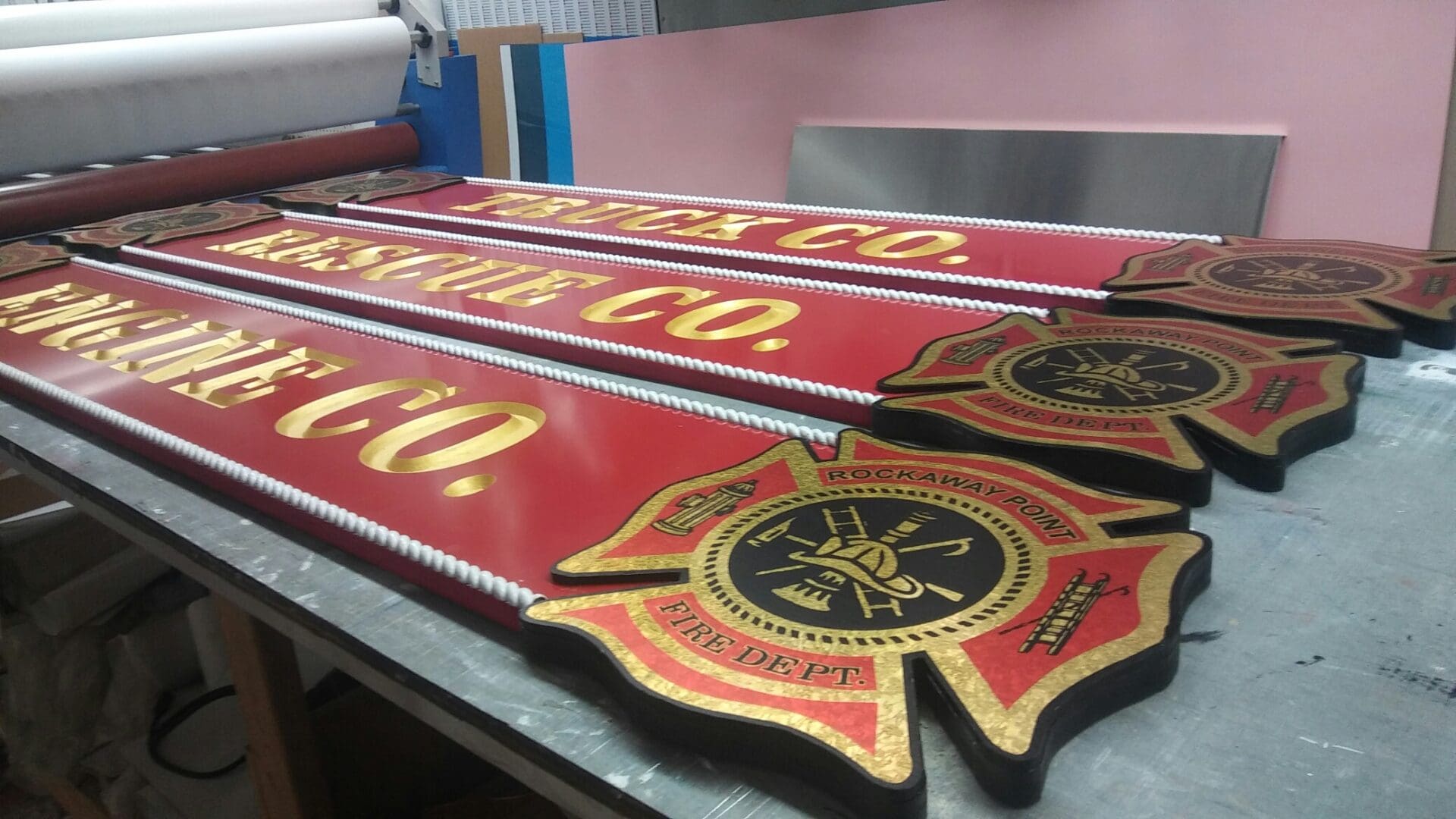 A group of red and gold signs on top of a table.