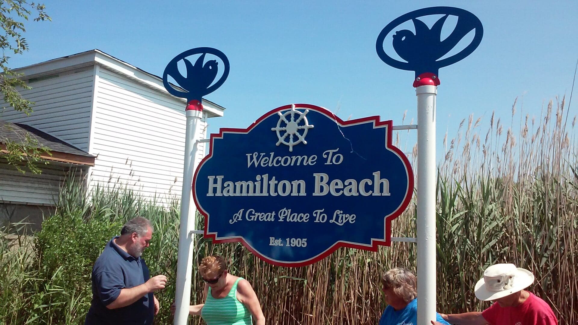 A sign that says welcome to hamilton beach