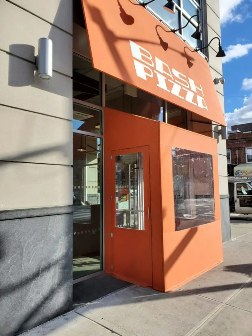 Orange awning with the text 