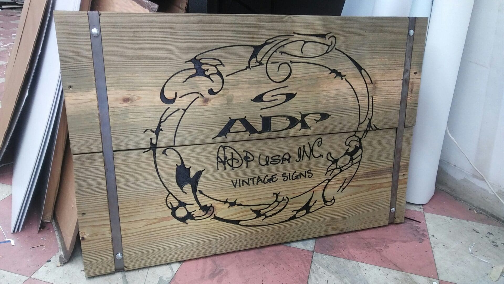 Wooden sign with the logo 